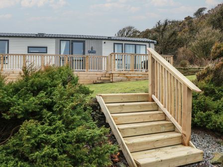 An exterior view of a property with steps and decking at Willow's Way in Stranraer