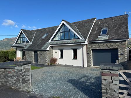 A house with a garage and garden at Lakes View in Keswick