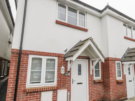 A house facade with windows and doors at 8 Park View Grove Weymouth