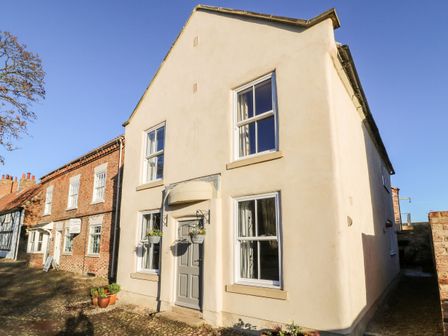 An exterior view of a house with windows and a door at The Old Post Office in York