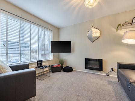 A living room with a television and a sofa at 2 Bed House - Sleeps 4 - Garden - Parking - Wifi in Kendal