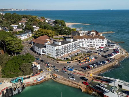 An aerial view of The Haven Hotel with beach and water in Sandbanks