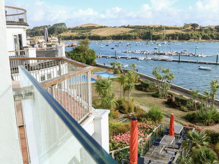 A view of a marina with boats and a pool at 24 The Salcombe in Salcombe