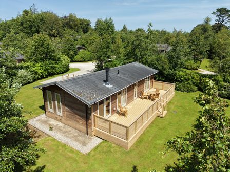A house with a deck and seating area at 4 Southern Place in Dobwalls
