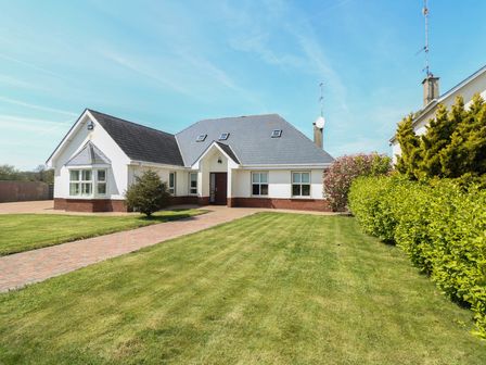 A house with a garden and pathway at Sunnyside River Chapel near Courtown, County Wexford