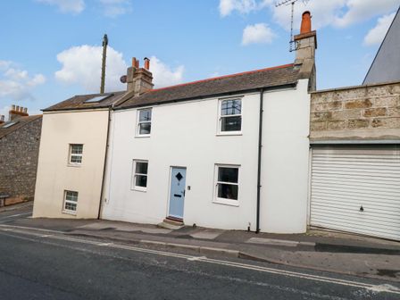 A house with white facade and windows at NO 10 Fortuneswell