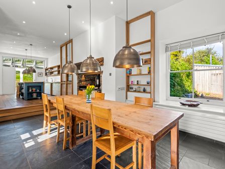 A kitchen with a dining table and chairs at Chantry Studio in Kingsbridge