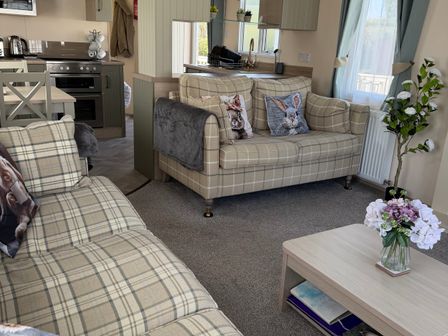 A living room with a couch and coffee table at Hoburne Blue Anchor - Holiday Accommodation 307 Minehead