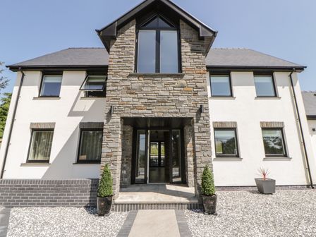 A house entrance with stone facade and windows at Brynseion Uchaf near Aberystwyth