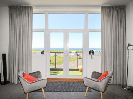A living room with a sea view at Portland View in Portland Bill