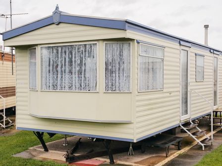 A caravan with windows and a door at Number 186 Owens caravan park Abergele