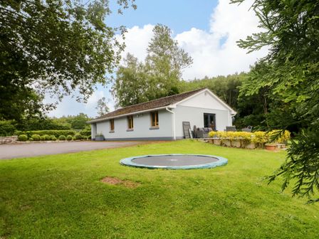A house with a trampoline and garden at a 3 bed property in