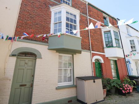 A residential building with a door and window at The Watch House in Weymouth