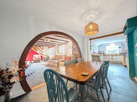 A dining room with a table and chairs at The Old Barn near St Ives Rustic Charm Space Lelant