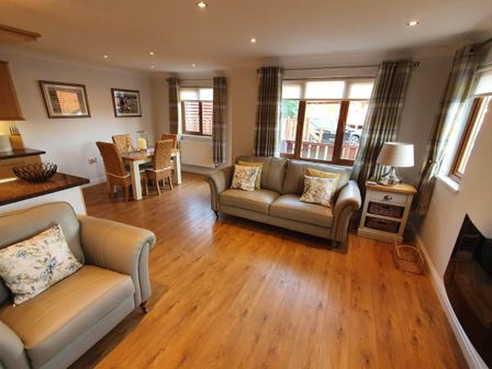 A living room with seating and dining area at Stunning 2 Bedroom Pet Friendly Lodge in Bridlington