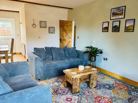 A living room with a sofa and coffee table at
