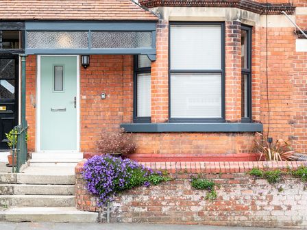 A door with a window and flowers at 38 Ashville Avenue Scarborough