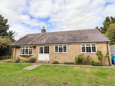 A house with garden and pathway at Hedley Dene Cottage in Longhorsley