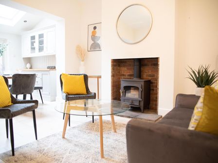A living room with a coffee table and wood stove at York Minster 3bed Sleeps 6 Fireplace Free Parking in York