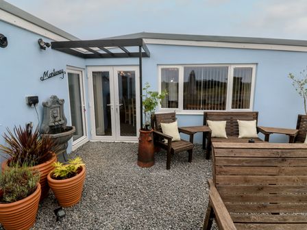 An outdoor area with seating and a fountain at The Hideaway at Monterey Helston