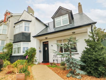 A house with a pathway and plants at 11 Bryn Goleu Avenue North Holyhead