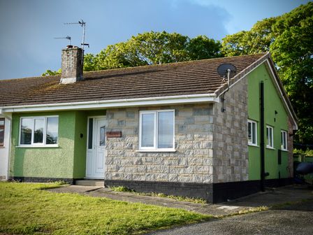 A house with a garden and chimney at Ty Marlyn St Davids