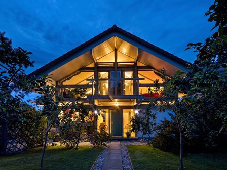 A house with illuminated windows at Two Hoots Littleworth