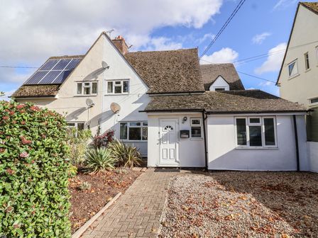 A house with a garden and solar panels at 19 Hailey Road