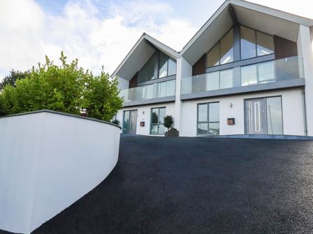 A house with two sections and a driveway at 1 Endellion View Wadebridge