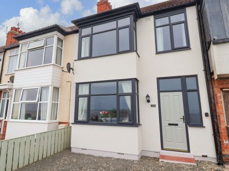 A house exterior with multiple windows and a door at Sea View House in Hornsea