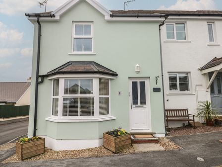 A house with a front door and window at Sandyhill House in Saundersfoot