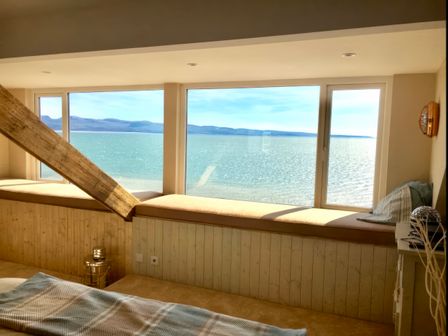 A living room with a sea view and windows at The View in Criccieth