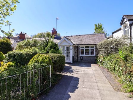 A front view of a house with garden at Ty Cerrig Dyserth