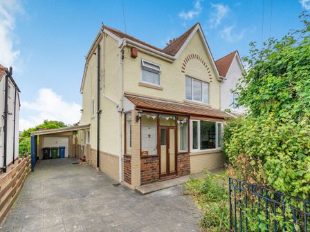 A two-story house with driveway garage and front garden at The Perks in Scarborough