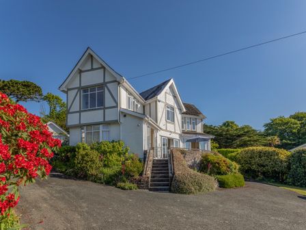 A two story house with garden and driveway at Windy Heath in Salcombe