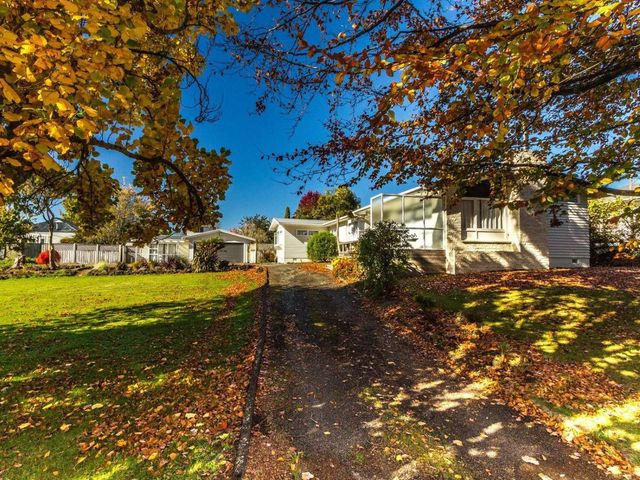 A house with driveway and trees at Kune Crib - Ohakune Holiday Home near Turoa in Ohakune