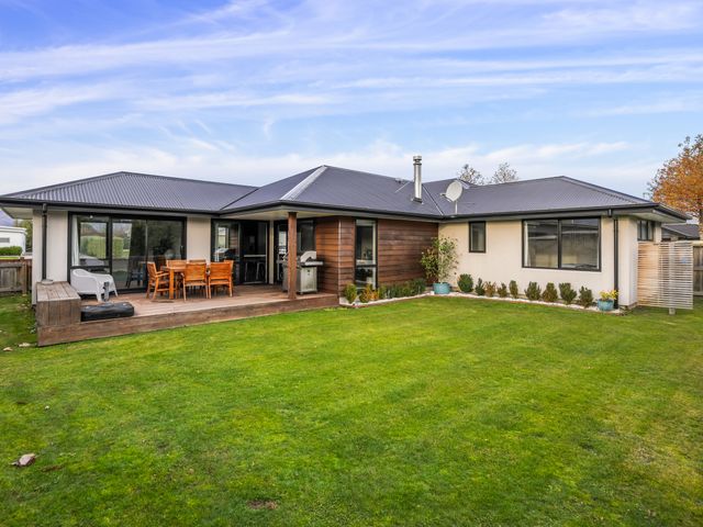 A house with a patio and lawn at Albert Town Wanaka Oasis - Wanaka