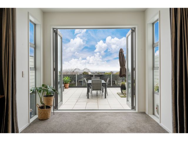 A balcony with outdoor furniture at Lakeview Luxury - Taupo Holiday Apartment, Taupo Central