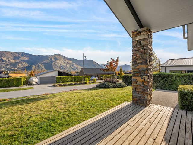 A view of mountains and grass from a deck at Mako Haven - Mountain Outlook in Wanaka