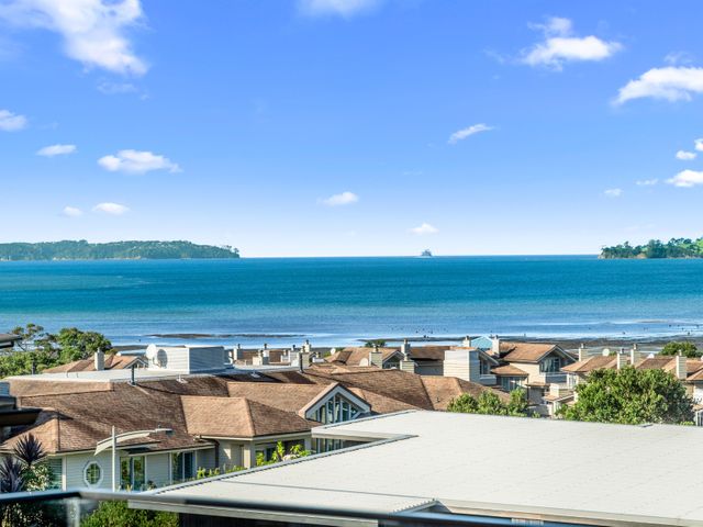 A view of the sea and houses at Kawau Bay Escape - Snells Beach Holiday Home Snells Beach