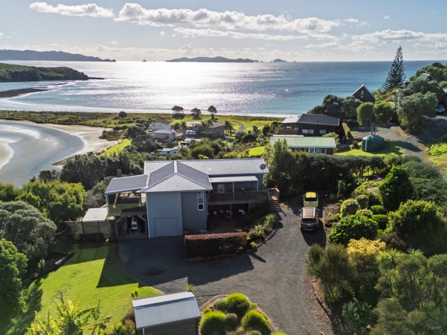 An ocean view with a house and garden at Coastal Serenity - Te Tii Escape