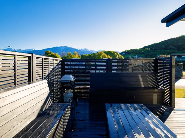 An outdoor area with benches and a grill at Kaikoura