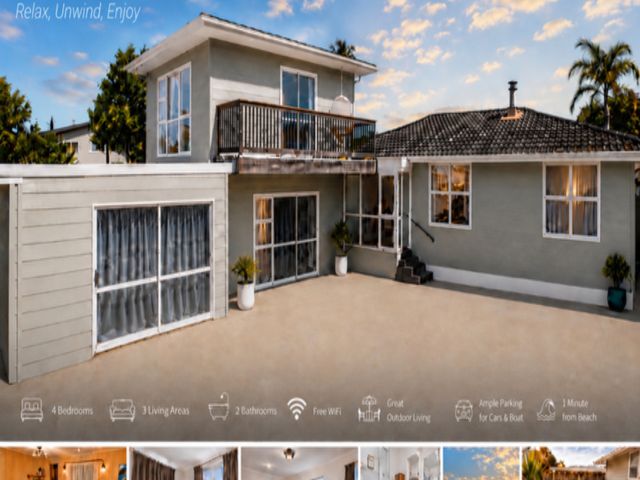A house with a balcony and outdoor area at Coastal Haven Retreat - 4 Bedrooms Ohope Beach