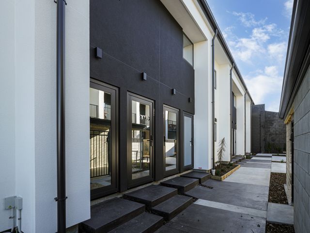 An outdoor pathway with steps leading to doors at Central Crossing - Christchurch Holiday Home, Christchurch