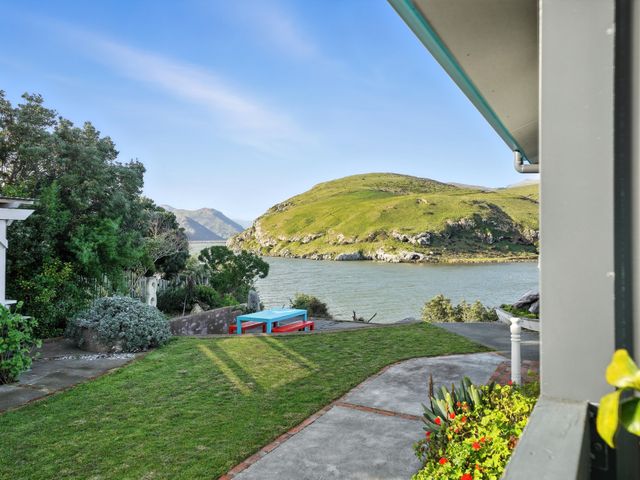 A garden with a view of water and mountains at Birdlings Flat Banks Peninsula