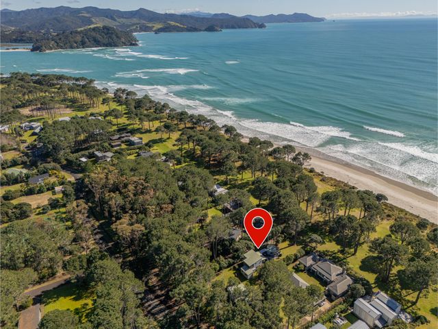 An aerial view of houses and beach at 