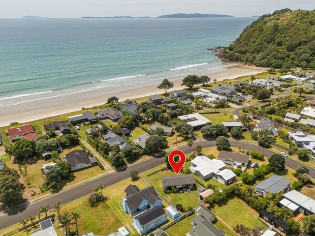 A view of houses near the beach at Matarangi Holiday Home in Whitianga
