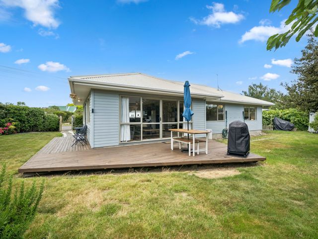 A house with a patio and garden at Martinborough Holiday Home, Martinborough