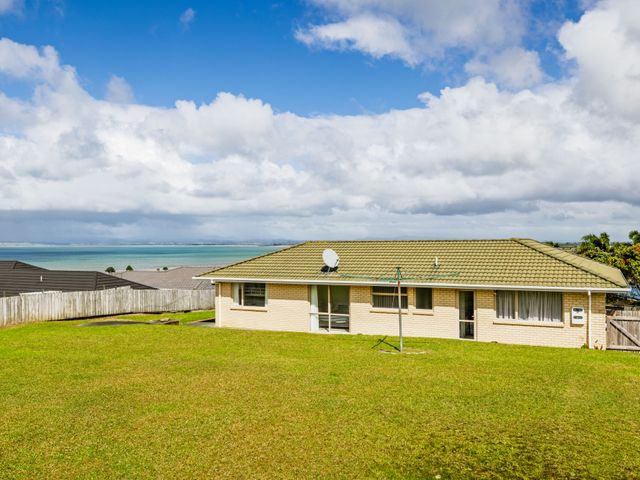 A house with a satellite dish and clothesline at Bay Heights Bach - Bay Of Islands Retreat, Kaitaia
