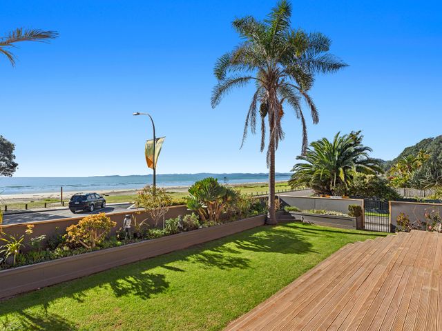 An outdoor area with a view of the beach and ocean at The Lights House - Beachfront Ohope Holiday Home Ohope